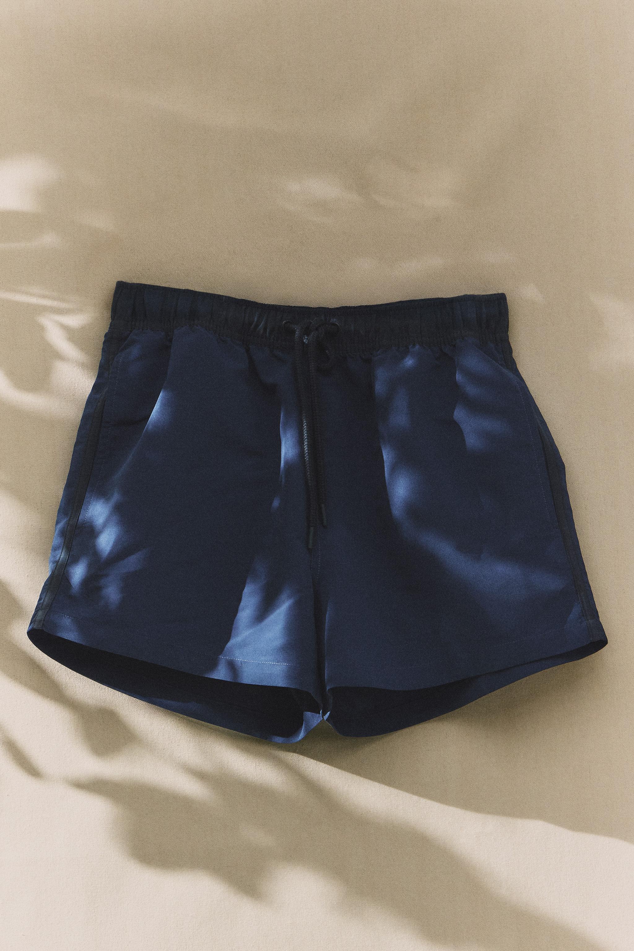 SHORT DE BAIN UNI À CONTRASTE